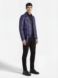 Side profile of Maverick Vector blue leather jacket showing zippered sleeve cuffs and open front silhouette. Maverick Jacket.