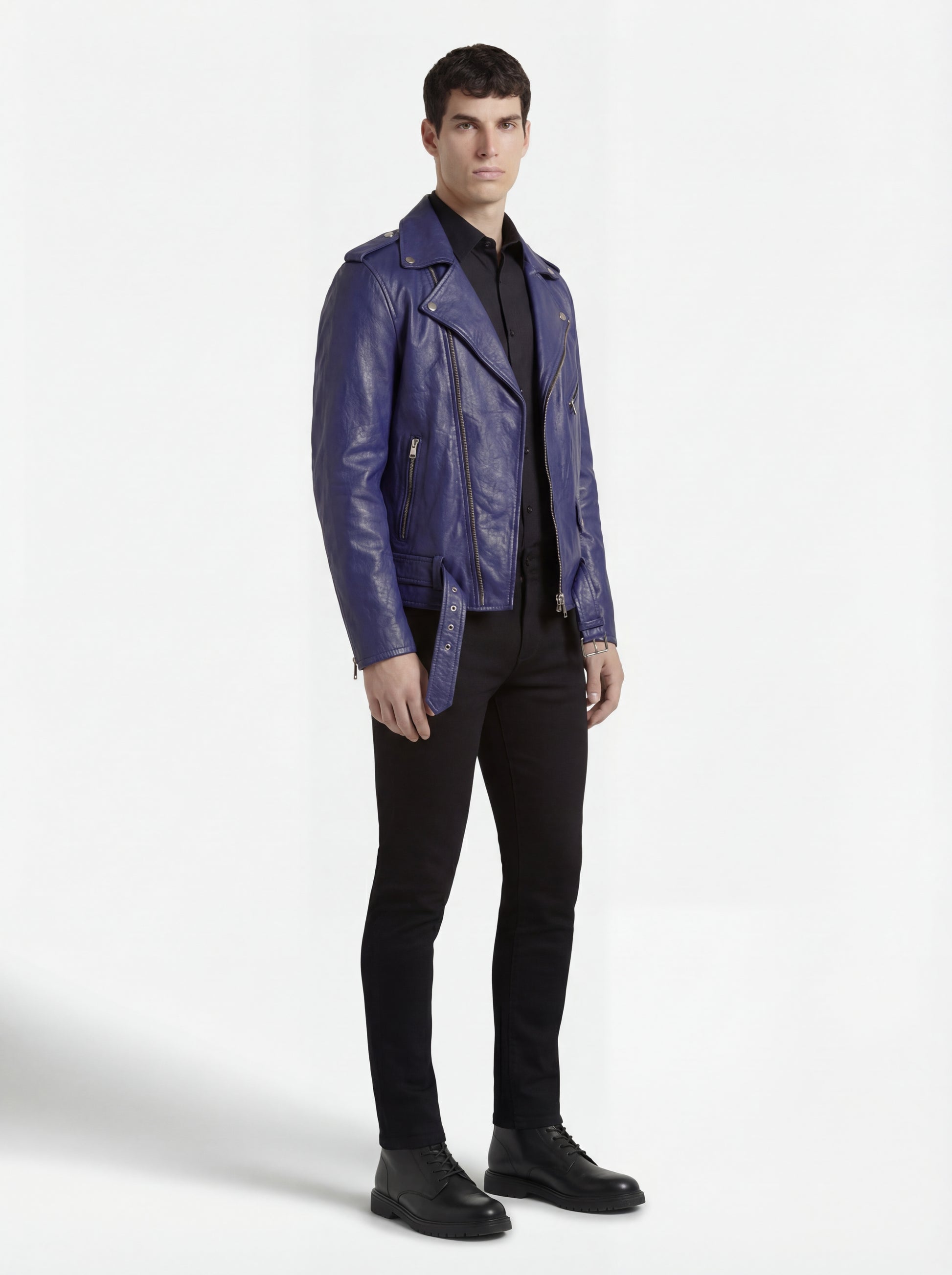 Side profile of Maverick Vector blue leather jacket showing zippered sleeve cuffs and open front silhouette. Maverick Jacket.