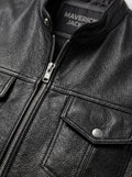 Macro shot of smooth black leather texture and heavy-duty silver zipper hardware on biker vest. The Riot by Maverick Jacket.