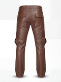 Rear view of saddle brown leather cargo trousers showing rear flap pockets and knee articulation seams. The Cassian by Maverick Jacket.
