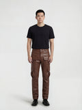 Male model wearing Maverick Cassian leather cargo trousers, regular fit, styled with black crewneck t-shirt. Maverick Jacket.