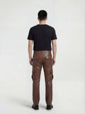Rear view of male model wearing Maverick Cassian leather cargo trousers showing tailored seat fit and straight leg structure. Maverick Jacket.