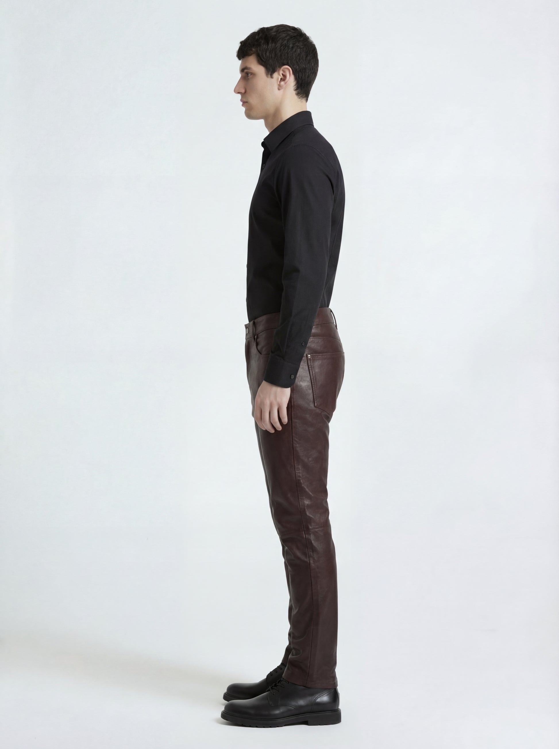 Side profile of Maverick Kade leather trousers showing knee articulation and straight silhouette. Maverick Jacket.