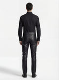 Rear view of male model wearing Maverick Caliber black pebbled leather pant showing fitted seat silhouette and straight leg cut. Maverick Jacket.
