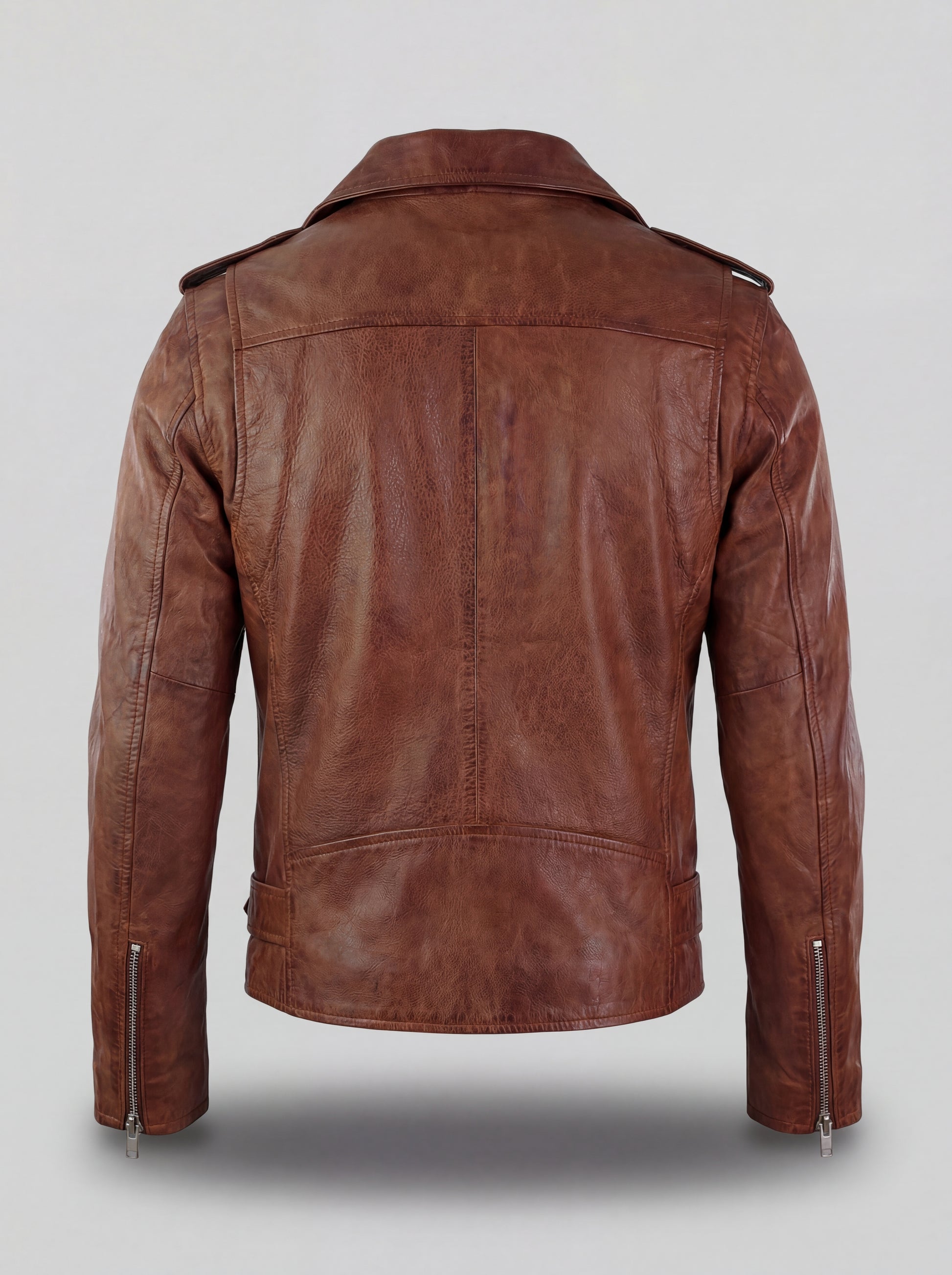 Rear view of brown leather biker jacket showing vertical center seam and structured shoulder yoke. The Apex by Maverick Jacket.