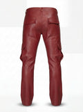 Rear view of red leather cargo pants showing rear button-flap pockets and knee articulation seams. The Cassian by Maverick Jacket.