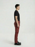 Side profile of Maverick Cassian leather cargo pants showing dimensional cargo pocket placement and straight silhouette. Maverick Jacket.
