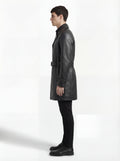 Side profile of Maverick Sovereign leather trench coat showing adjustable cuff strap detail and straight mid-length silhouette. Maverick Jacket.