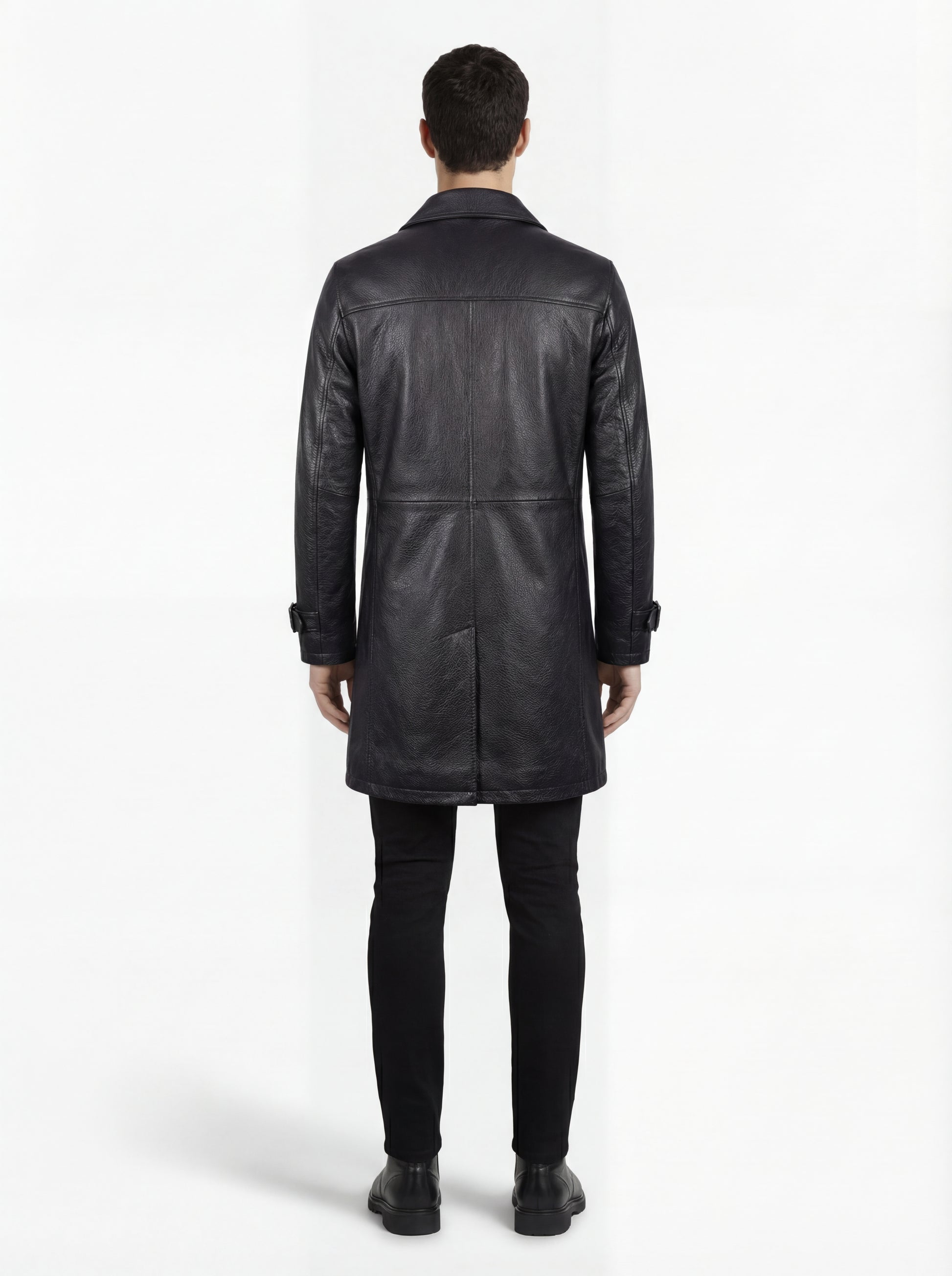 Rear view of male model wearing Maverick Hawk leather car coat showing structured shoulder fit and clean vertical paneling. Maverick Jacket.