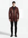Male model wearing Maverick Consul leather coat, tailored fit, styled with black button-down shirt and black skinny jeans. Maverick Jacket.