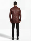 Rear view of male model wearing Maverick Consul leather coat showing structured shoulder fit and clean back paneling. Maverick Jacket.