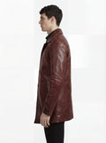 Side profile of Maverick Consul leather coat showing long sleeve structure and straight mid-length silhouette. Maverick Jacket.