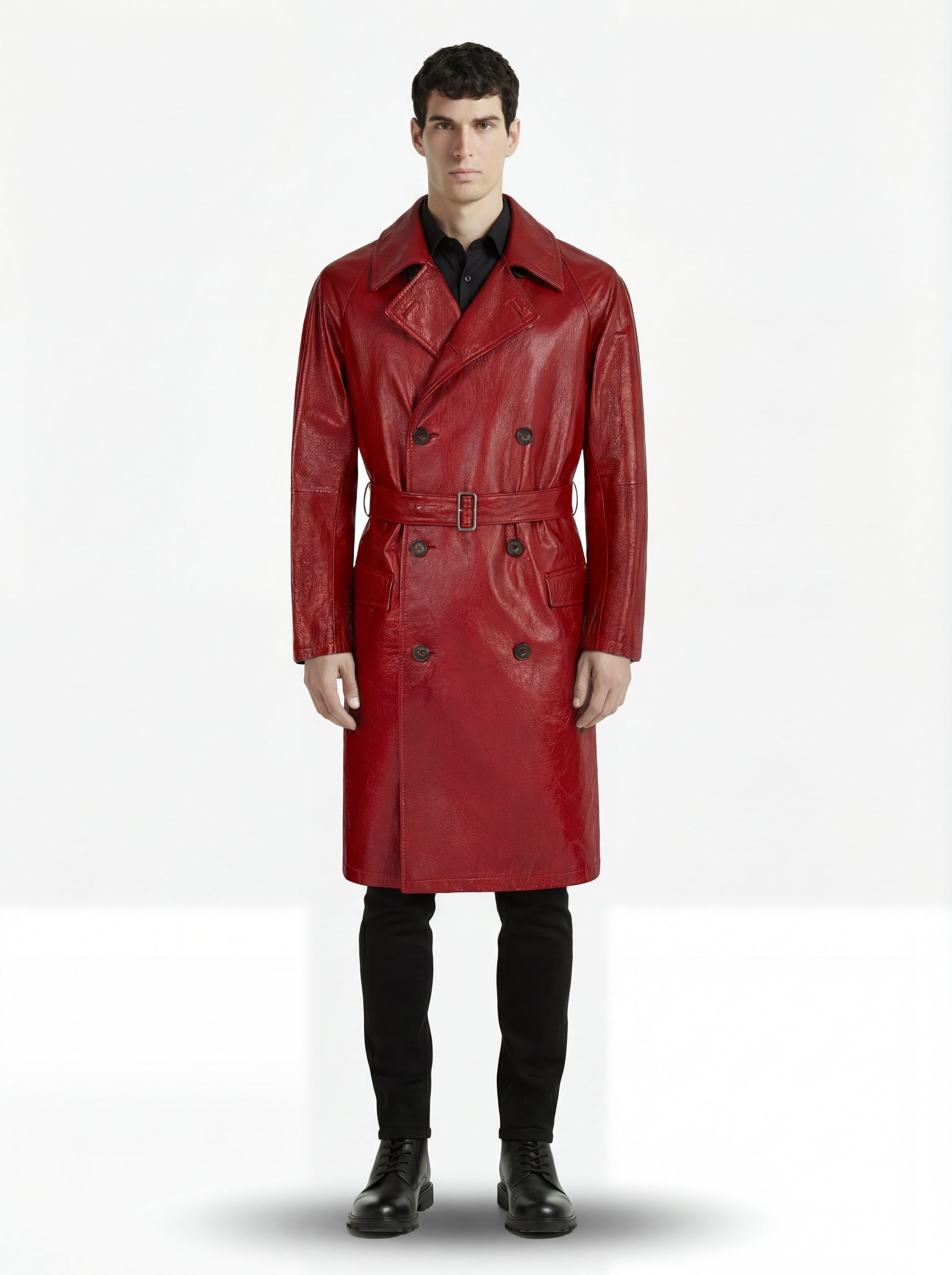 Male model wearing Maverick Valerian leather trench coat, tailored fit, styled with black slim-fit trousers and black leather boots. Maverick Jacket.