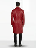 Rear view of male model wearing Maverick Valerian leather trench coat showing structured shoulder drape and belted back styling. Maverick Jacket.