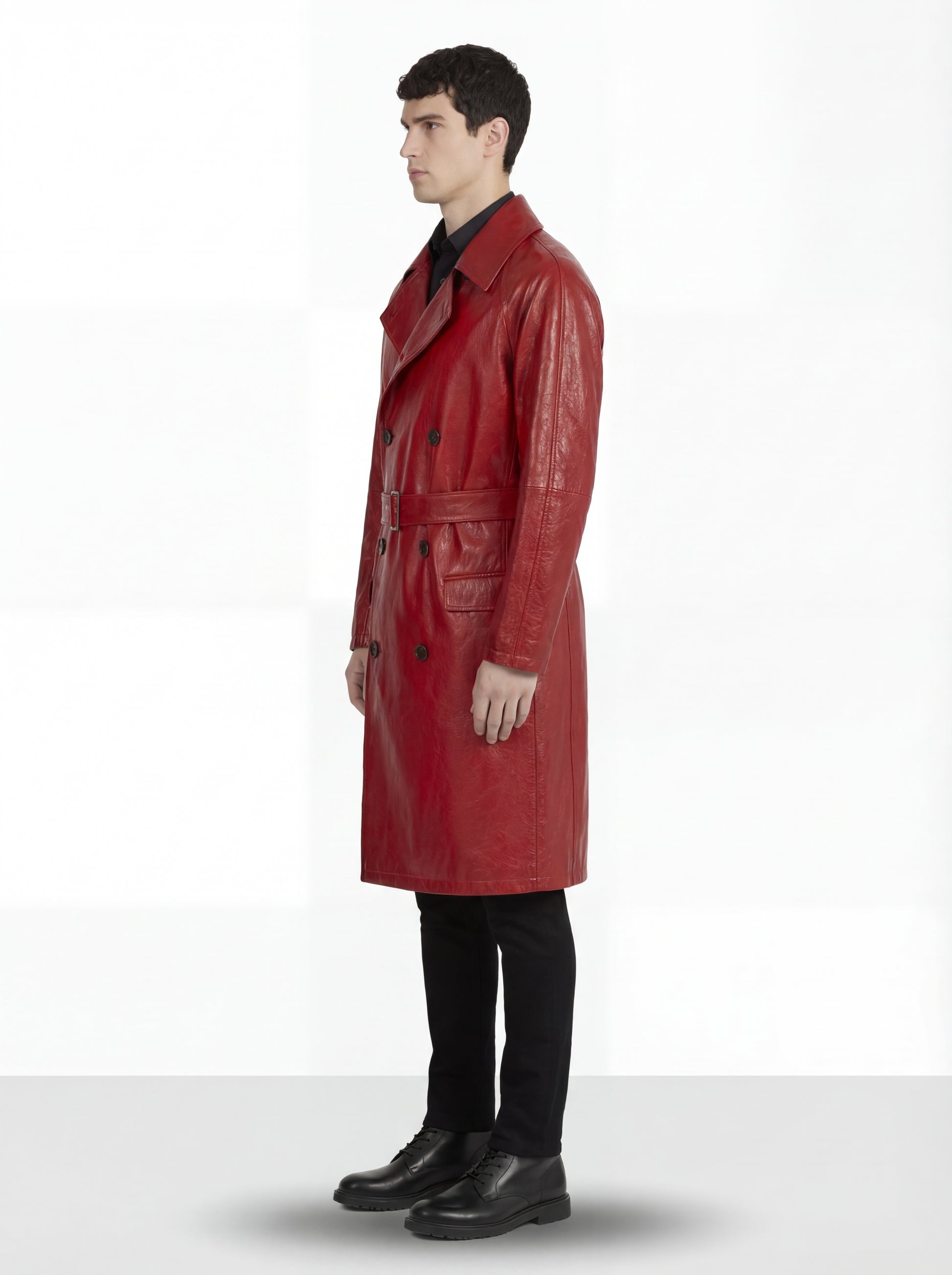 Side profile of Maverick Valerian leather trench coat showing raglan sleeve construction and knee-length silhouette. Maverick Jacket.