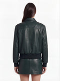 Rear view of female model wearing Maverick Isla leather bomber jacket showing structured shoulder fit and elasticated hem styling. Maverick Jacket.