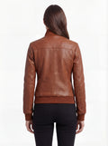 Rear view of female model wearing Maverick Blair leather bomber jacket showing fitted silhouette and ribbed hem styling. Maverick Jacket.