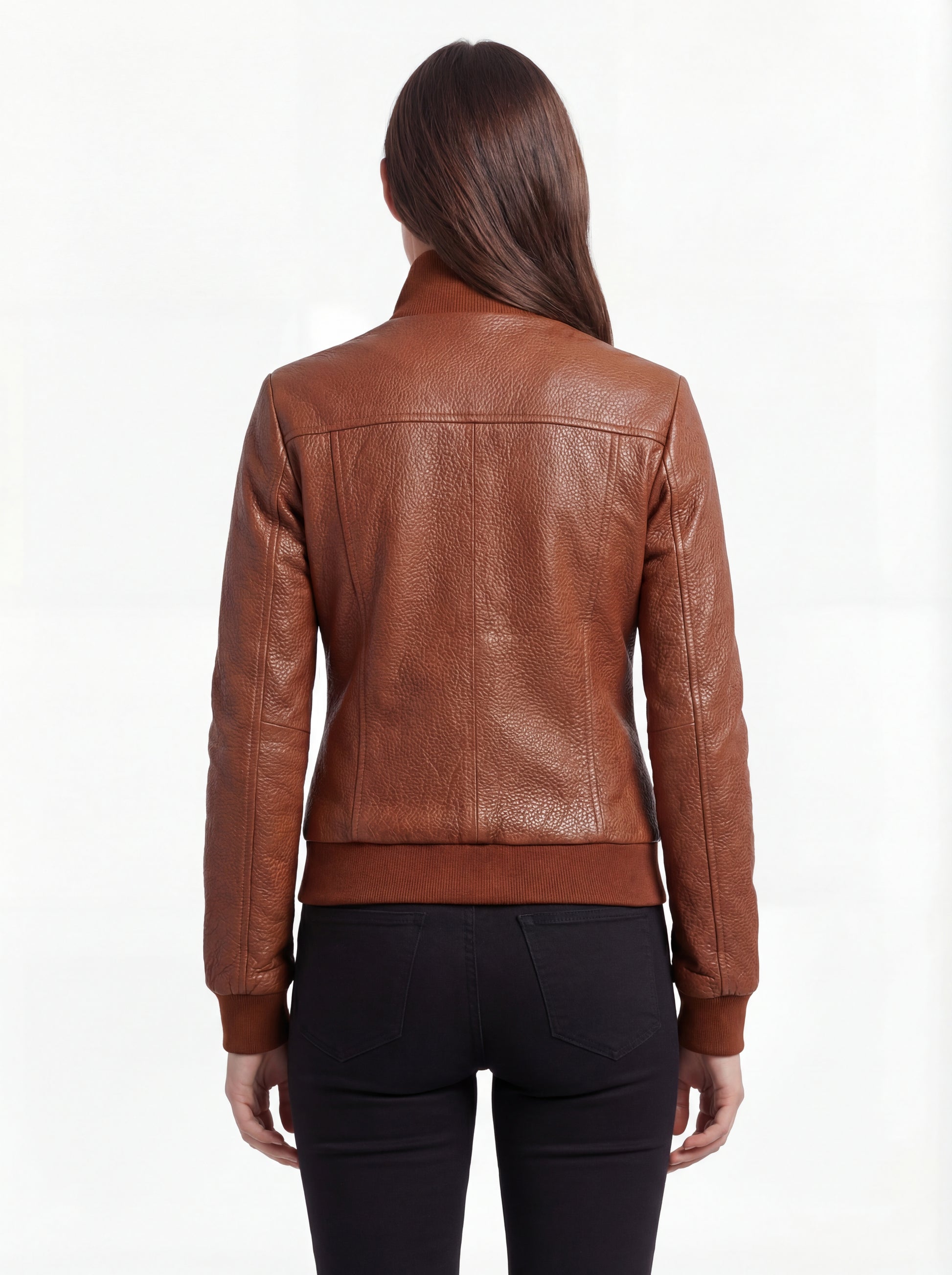 Rear view of female model wearing Maverick Blair leather bomber jacket showing fitted silhouette and ribbed hem styling. Maverick Jacket.