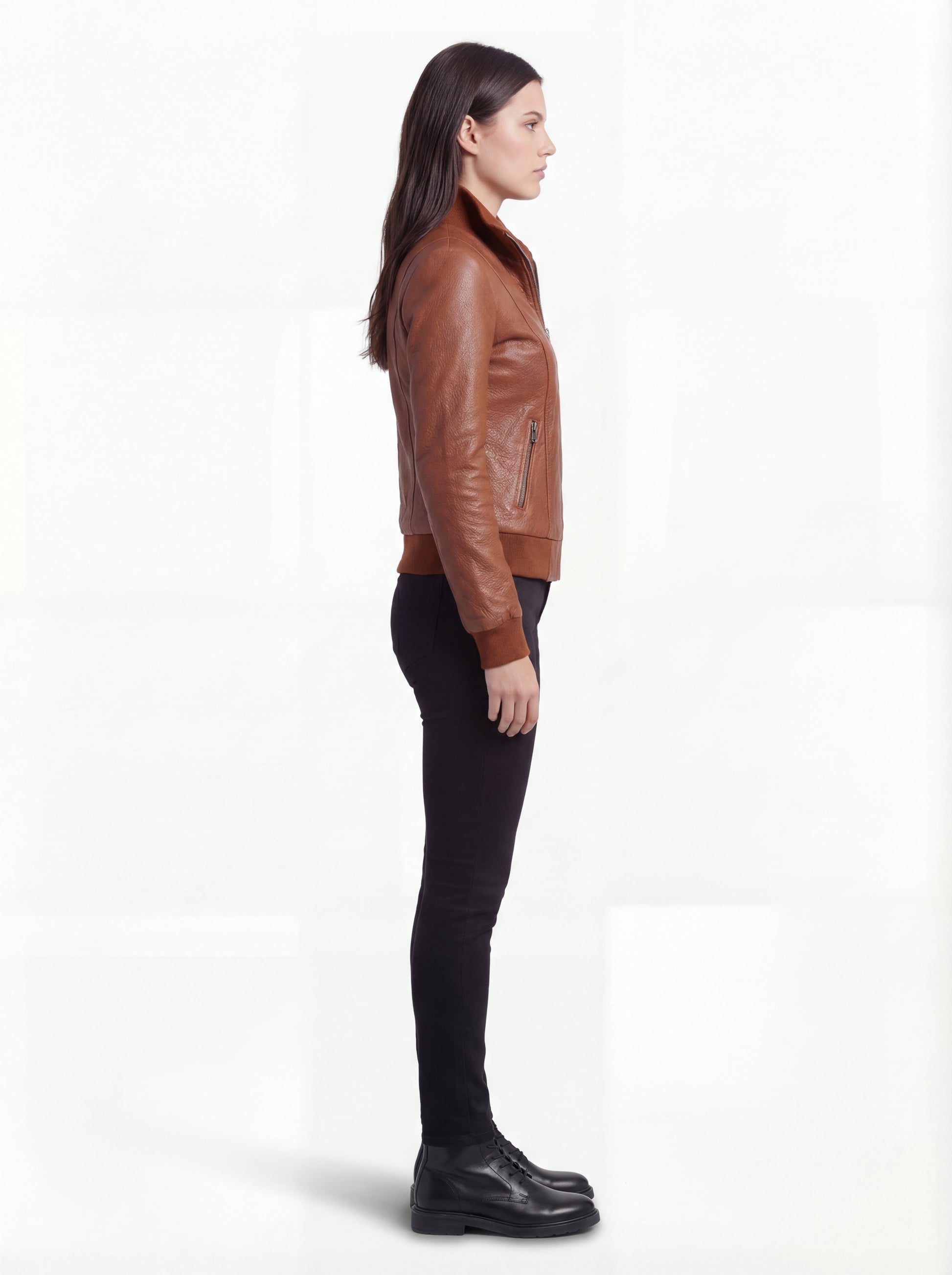 Side profile of Maverick Blair bomber jacket showing long sleeve structure and ribbed cuff detail. Maverick Jacket.