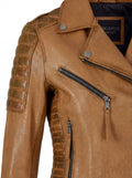 Macro shot of distressed tan leather texture and silver zipper chest pocket on biker jacket. The Ava by Maverick Jacket.