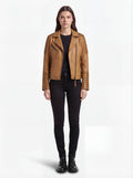 Female model wearing Maverick Ava leather biker jacket, slim fit, styled with black skinny jeans and black combat boots. Maverick Jacket.