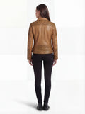Rear view of female model wearing Maverick Ava leather biker jacket showing structured shoulder fit and diamond quilted back yoke. Maverick Jacket.