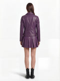 Rear view of female model wearing Maverick Iris leather biker jacket showing fitted back silhouette and quilted shoulder construction. Maverick Jacket.