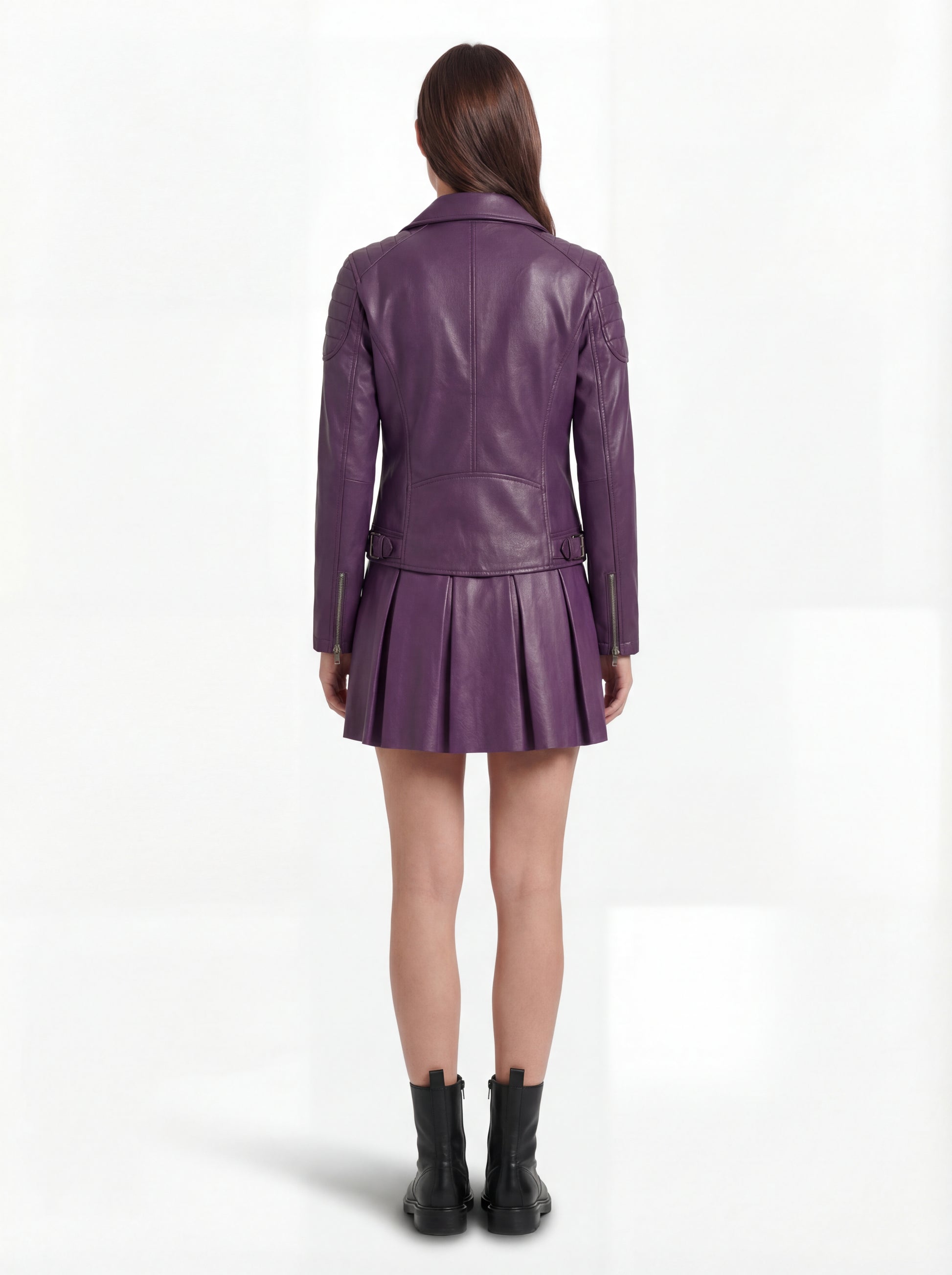 Rear view of female model wearing Maverick Iris leather biker jacket showing fitted back silhouette and quilted shoulder construction. Maverick Jacket.