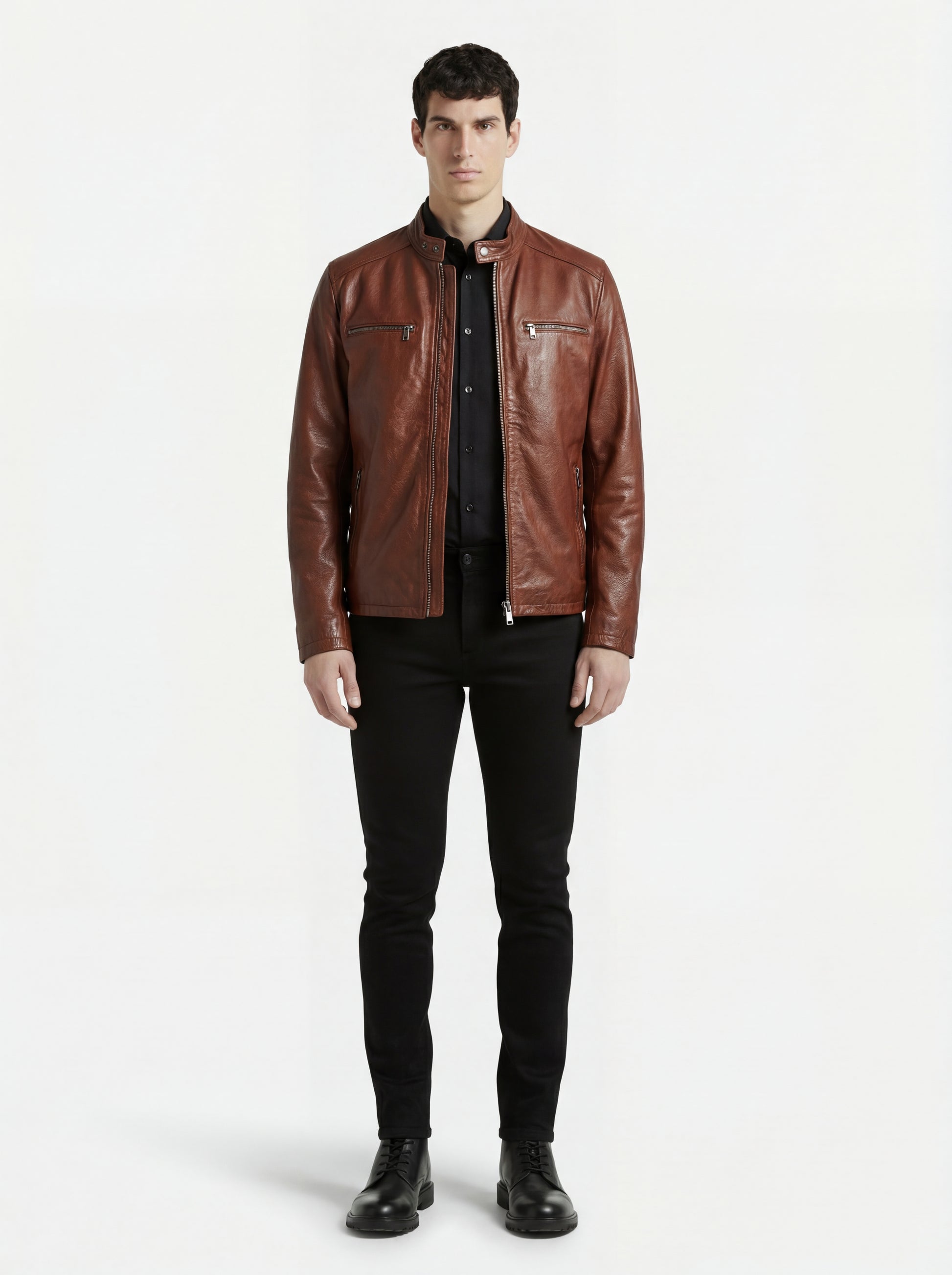Male model wearing Maverick Meridian cafe racer jacket, slim fit, styled with black button-up shirt and black skinny jeans. Maverick Jacket.