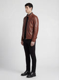 Side profile of Maverick Meridian cafe racer jacket showing zippered sleeve cuffs and streamlined torso fit. Maverick Jacket.