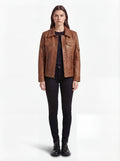 Female model wearing Maverick Quinn leather utility jacket, regular fit, styled with black skinny jeans and black top. Maverick Jacket.