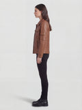 Side profile of Maverick Quinn utility jacket showing sleeve patch pocket and straight torso silhouette. Maverick Jacket.