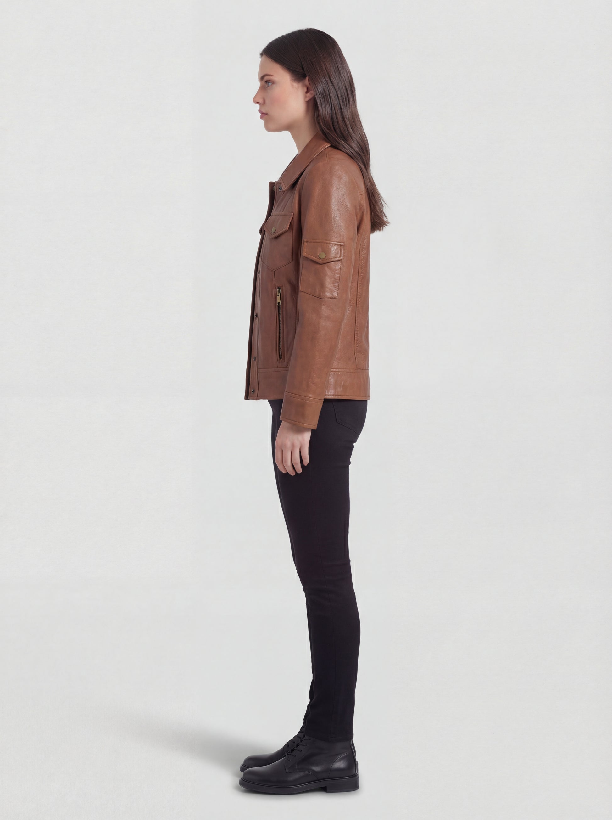 Side profile of Maverick Quinn utility jacket showing sleeve patch pocket and straight torso silhouette. Maverick Jacket.