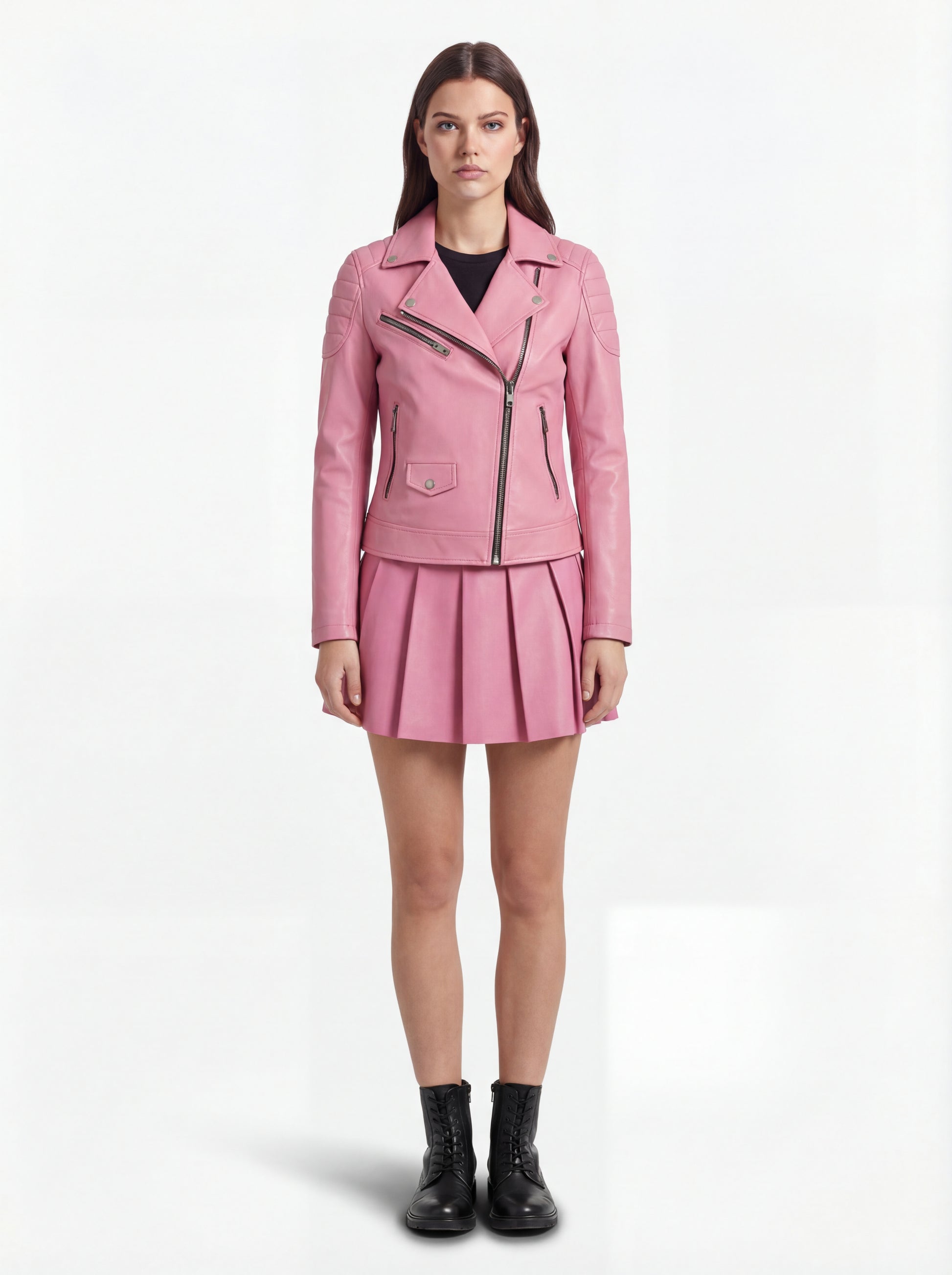 Female model wearing Maverick Harlow leather biker jacket, slim fit, styled with Maverick Poppy pink pleated leather skirt. Maverick Jacket.