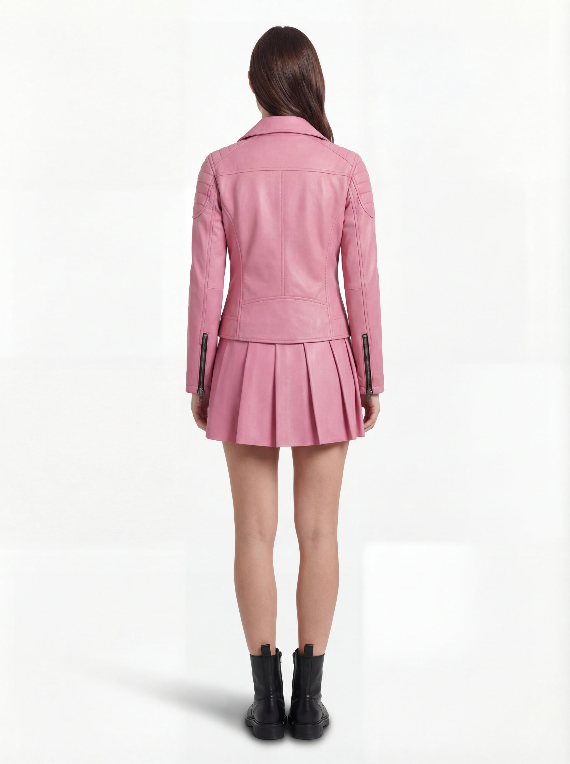 Rear view of female model wearing Maverick Harlow leather biker jacket showing structured shoulder fit and quilted panel construction. Maverick Jacket.