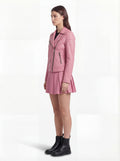 Side profile of Maverick Harlow biker jacket showing zippered sleeve cuffs and cropped waist silhouette. Maverick Jacket.