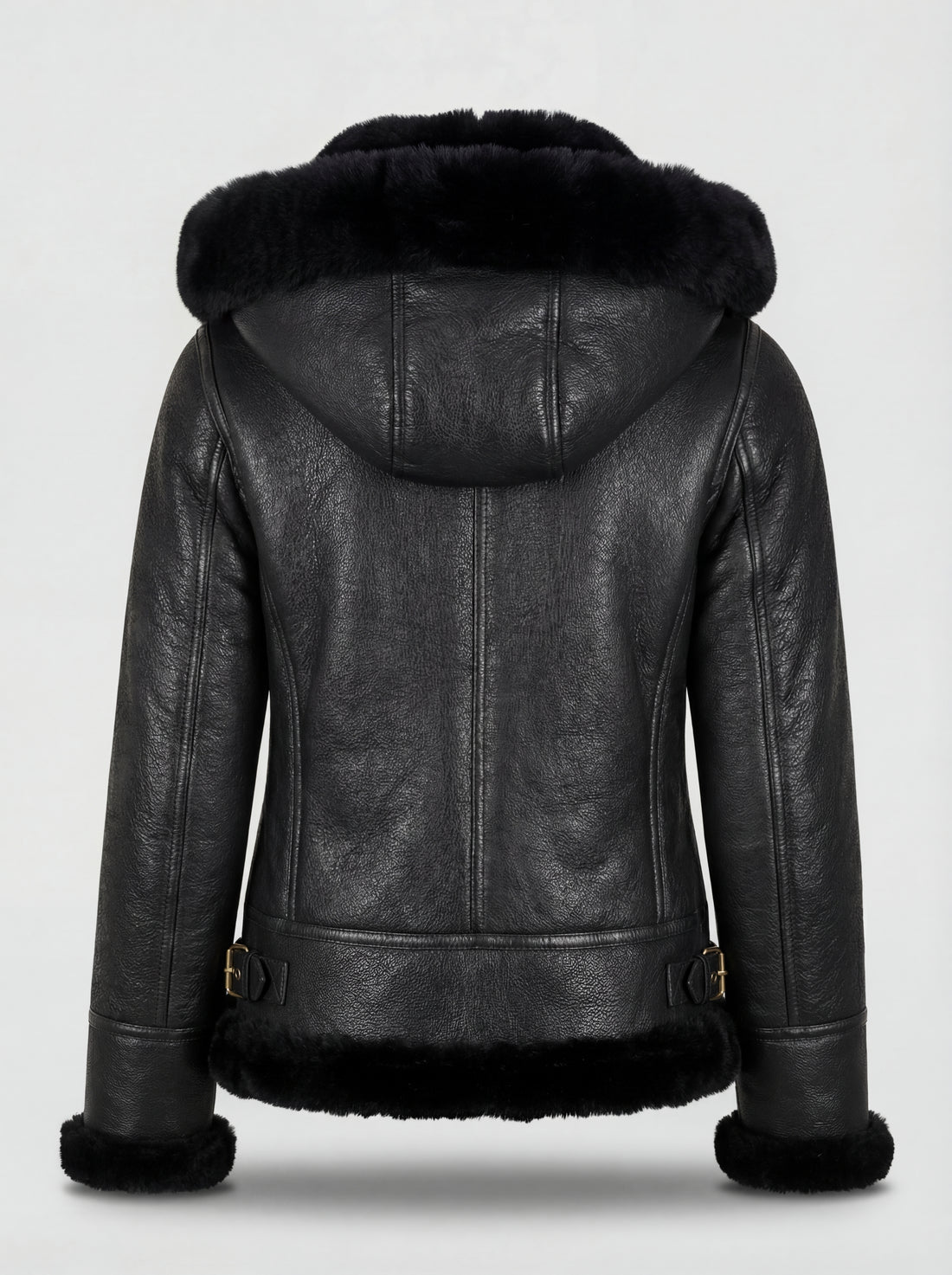 Women's black pebbled leather hooded shearling jacket with gold drawstring toggles and fur trim, Front View. The Kira by Maverick Jacket.
