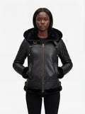Female model wearing Maverick Kira hooded shearling jacket, slim fit, styled with black skinny jeans. Maverick Jacket.