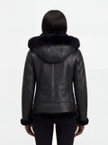 Rear view of female model wearing Maverick Kira hooded shearling jacket showing structured shoulder fit and hood drape. Maverick Jacket.
