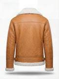 Rear view of camel pebbled leather aviator jacket showing structured shoulder yoke and adjustable waist buckles. The Flare by Maverick Jacket.