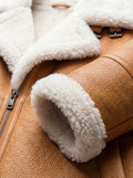 Macro shot of camel pebbled leather grain and plush white shearling texture on collar. The Flare by Maverick Jacket.
