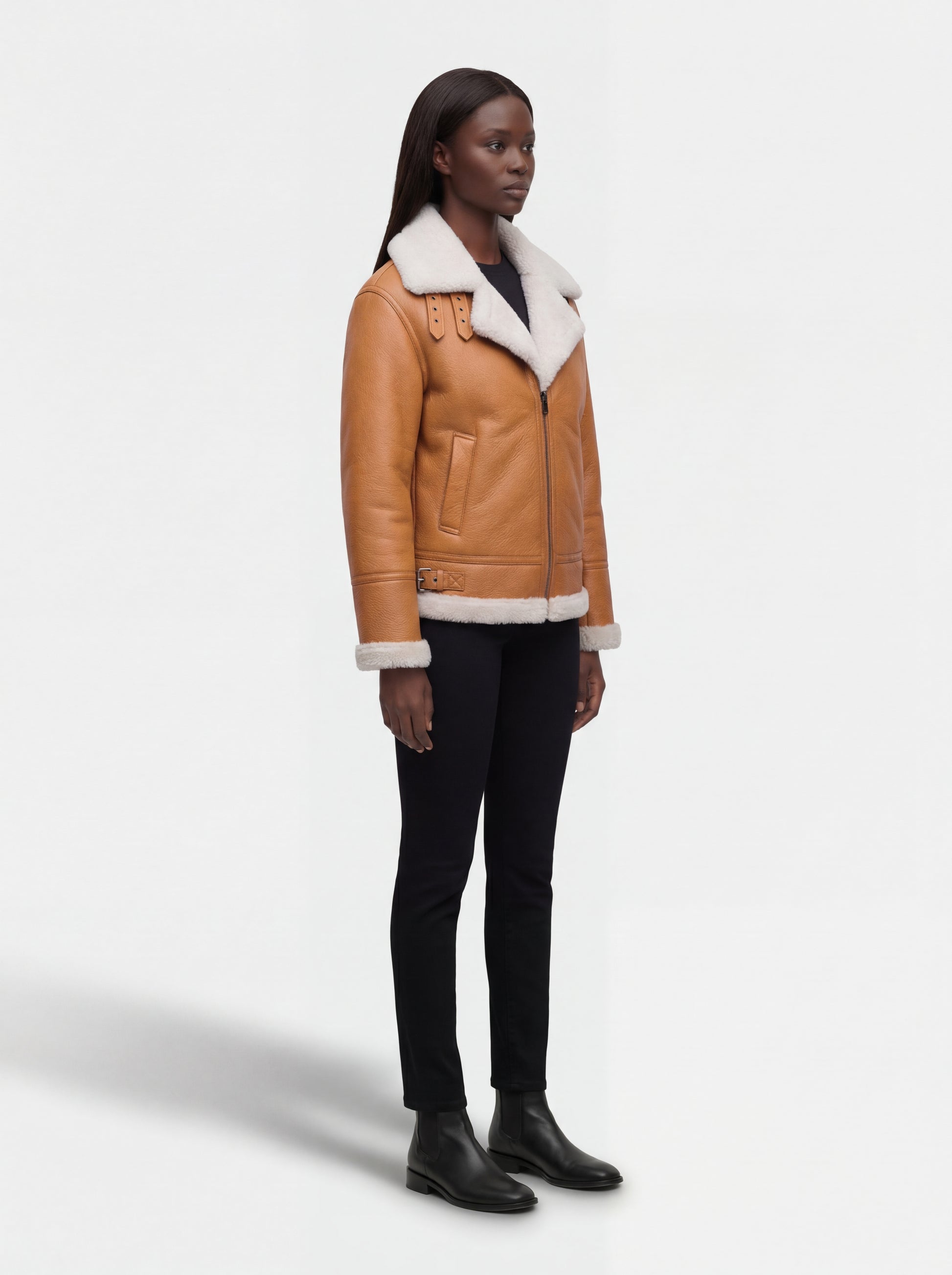 Side profile of Maverick Flare aviator jacket showing leather sleeve structure and tailored silhouette. Maverick Jacket.