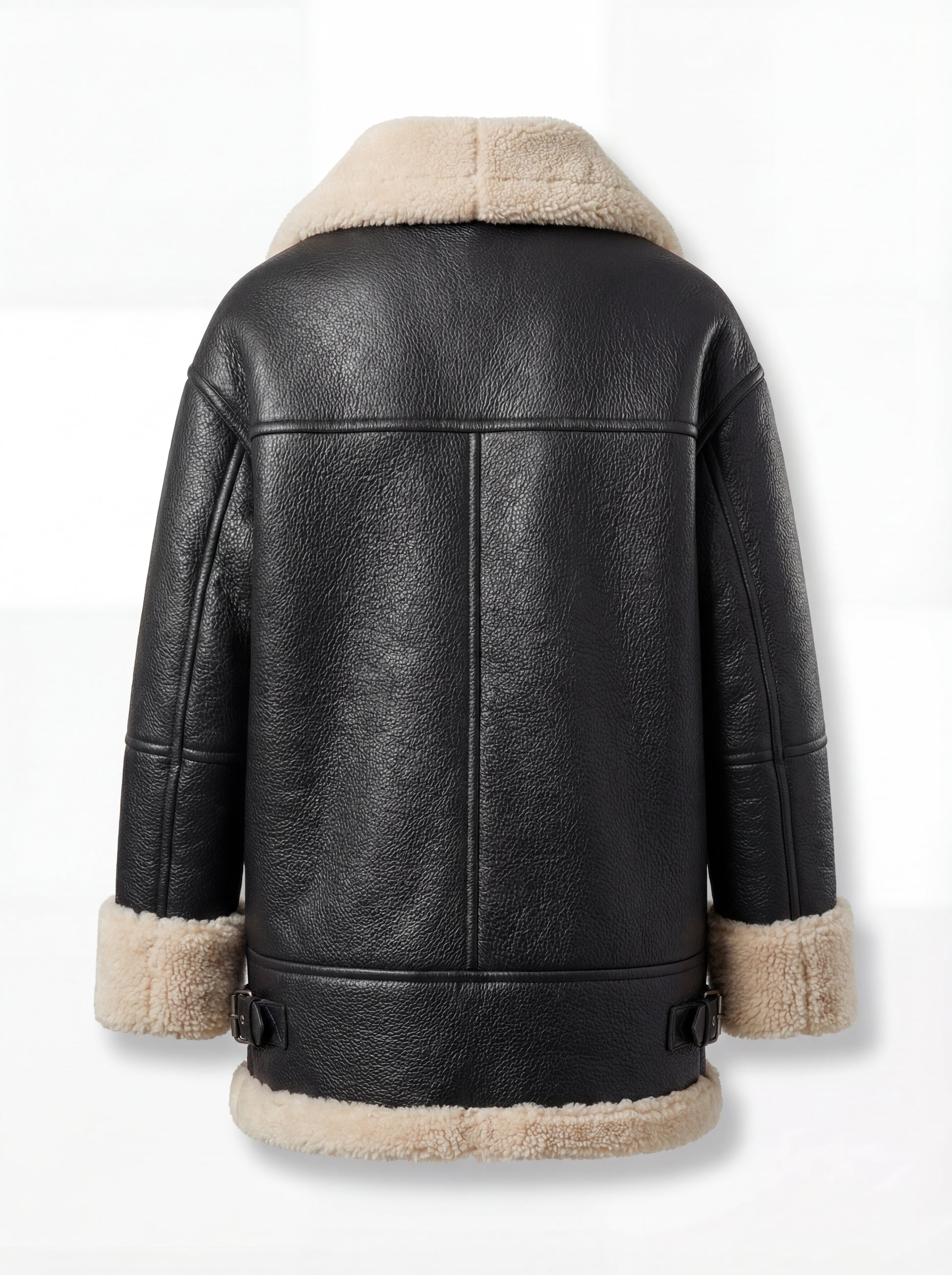 Rear view of black pebbled leather aviator jacket showing vertical center seam and adjustable side waist buckles. The Lyra by Maverick Jacket.