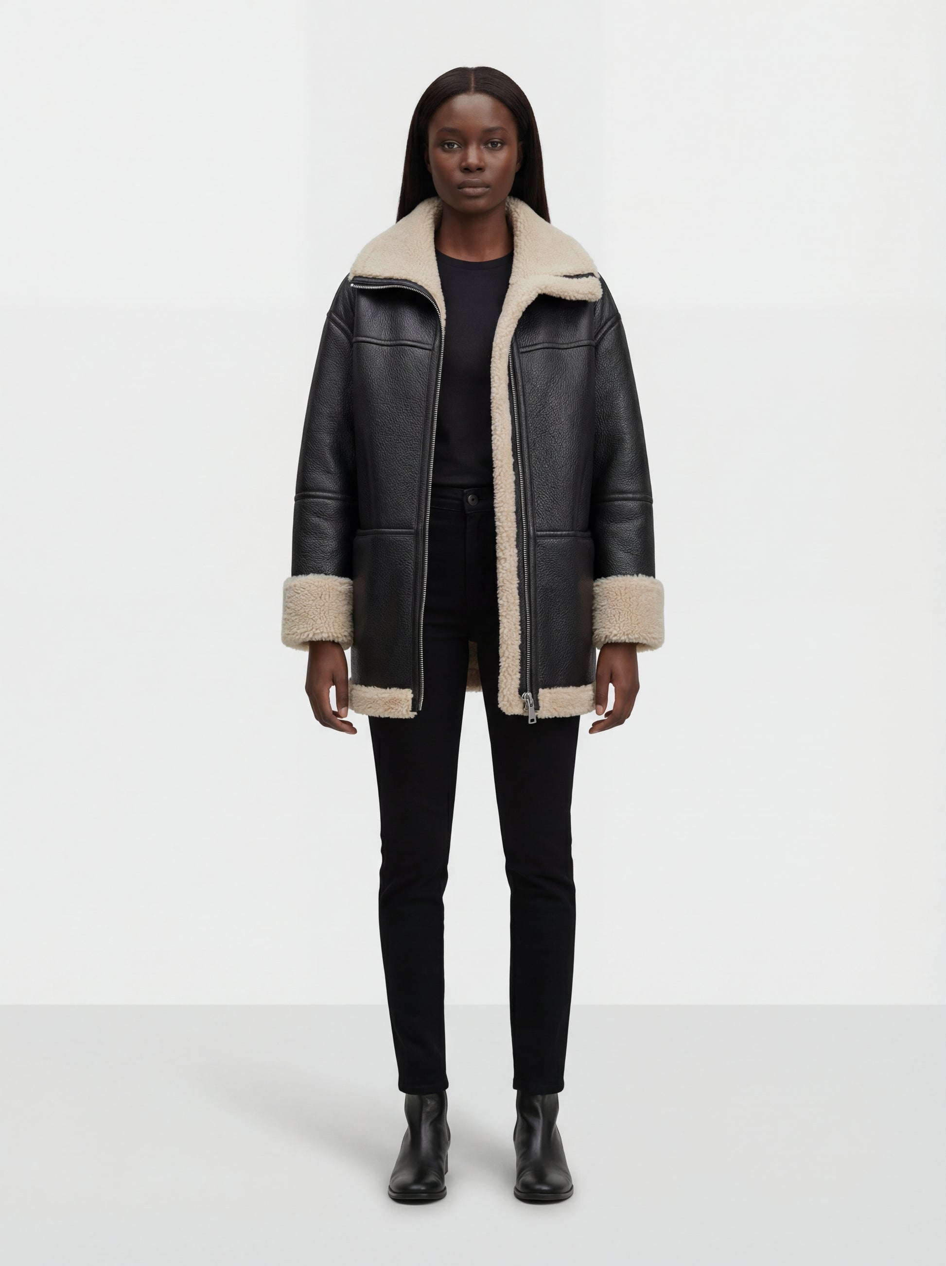 Female model wearing Maverick Lyra aviator jacket, longline fit, styled with black skinny jeans and leather ankle boots. Maverick Jacket.