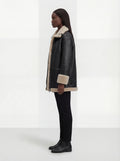 Side profile of Maverick Lyra aviator jacket showing shearling-cuffed sleeves and relaxed silhouette. Maverick Jacket.