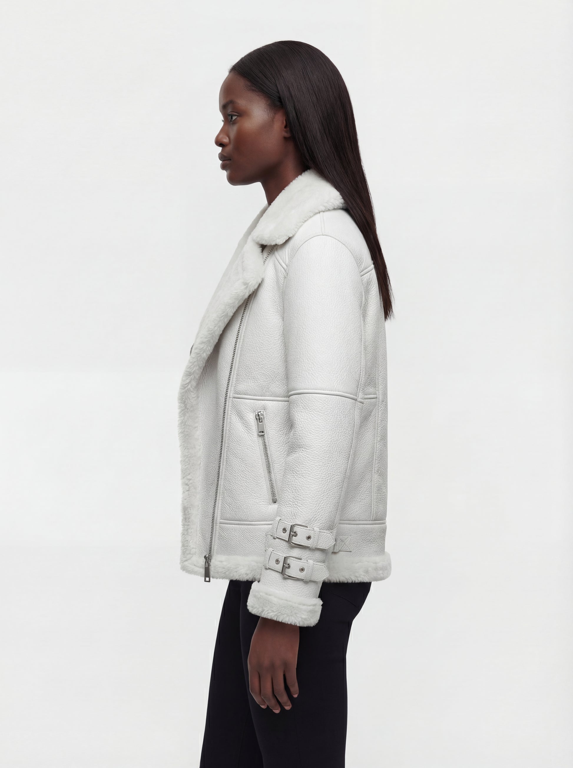 Side profile of Maverick Polaris biker jacket showing double buckle sleeve cuffs and cropped silhouette. Maverick Jacket.