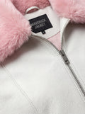 Macro shot of white pebbled leather grain and soft pink shearling texture on collar. The Venus by Maverick Jacket.