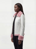 Side profile of Maverick Venus shearling biker jacket showing fur-trimmed sleeve cuffs and cropped silhouette. Maverick Jacket.