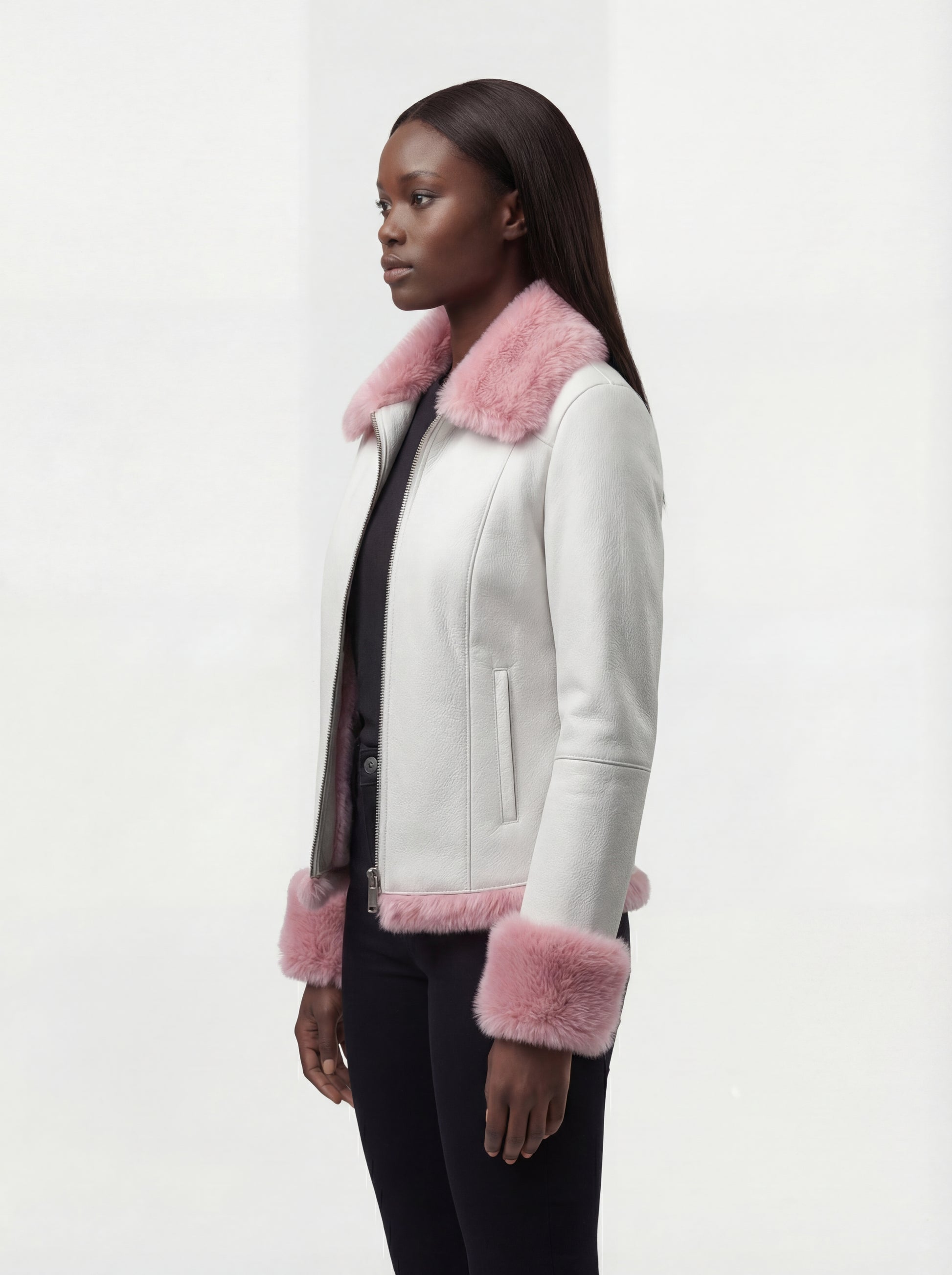 Side profile of Maverick Venus shearling biker jacket showing fur-trimmed sleeve cuffs and cropped silhouette. Maverick Jacket.