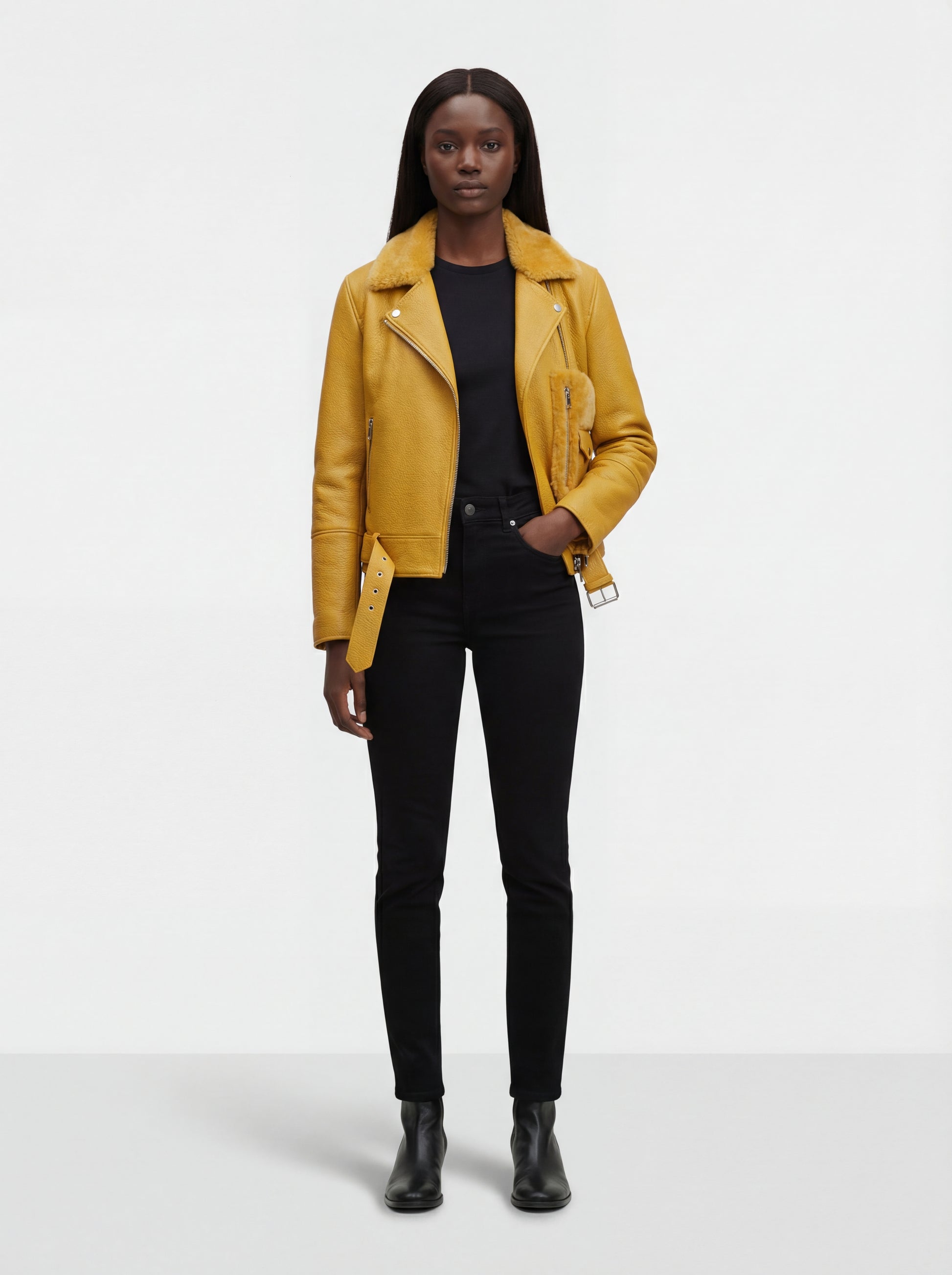 Female model wearing Maverick Solar biker jacket, slim fit, styled with black skinny jeans and leather Chelsea boots. Maverick Jacket.